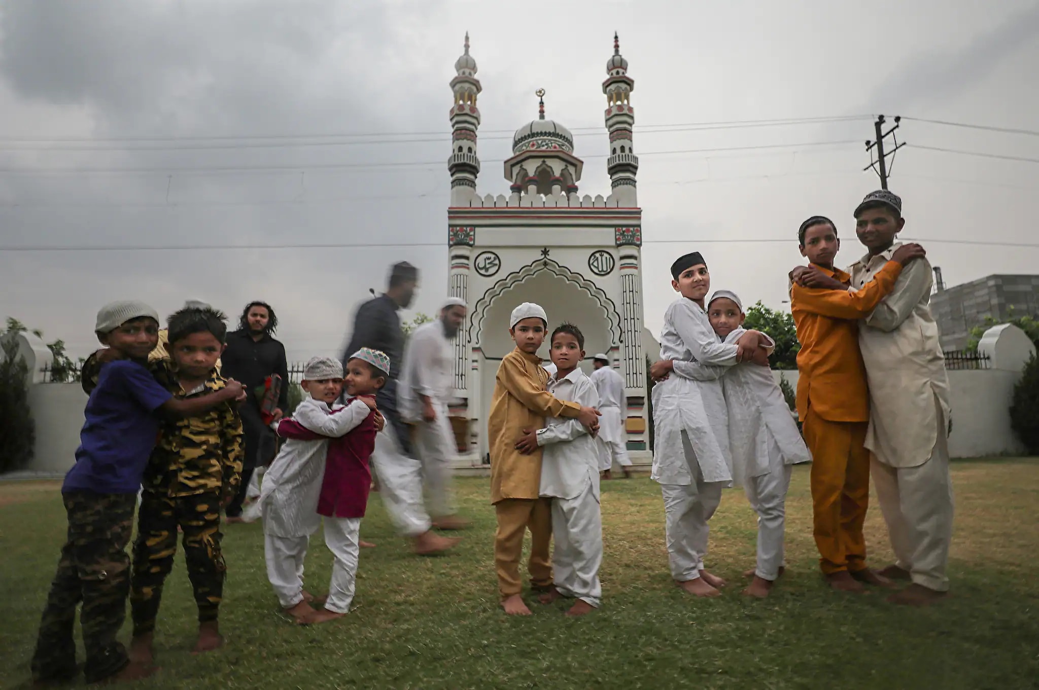 JAMMU: Muslim children greet each other as they celebrate the Eid-ul-Fitr festival, in Jammu, on Tuesday. (PTI Photo)