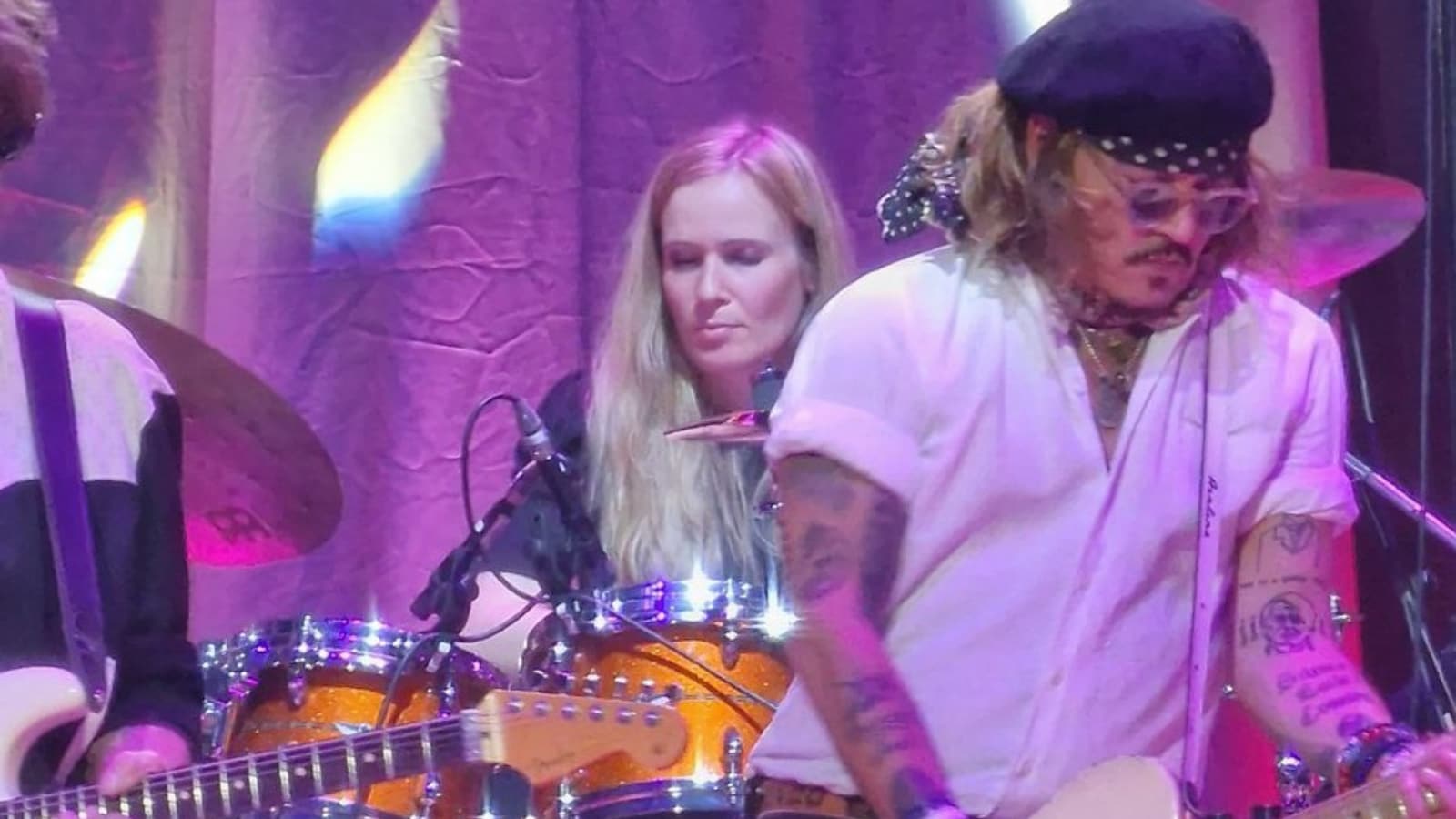 Johnny Depp Sings 'Isolation' in Surprise Performance as Amber Heard