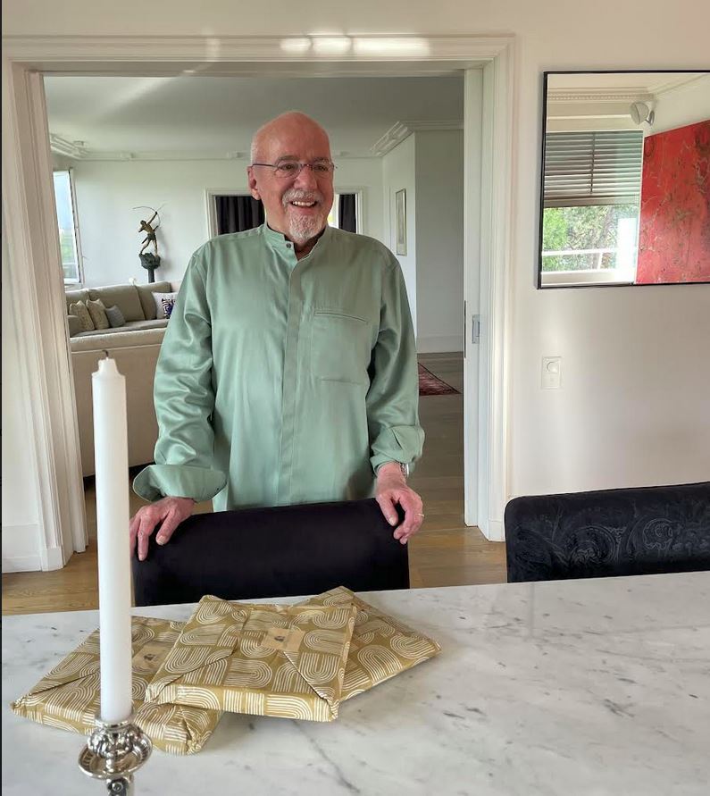 Paulo Coelho strikes a pose in a pastel green, Mandarin collared shirt sent to him by the sustainable brand.