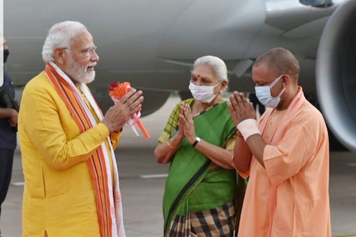 Prime Minister Narendra Modi received by UP governor Anandiben Patel and chief minister Yogi Adityanath in Lucknow on Monday. Pic/Twitter