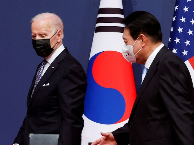 US president Joe Biden and his South Korean counterpart Yoon Suk-youl leave after a joint news conference at the People's House in Seoul, South Korea (Image: Reuters)