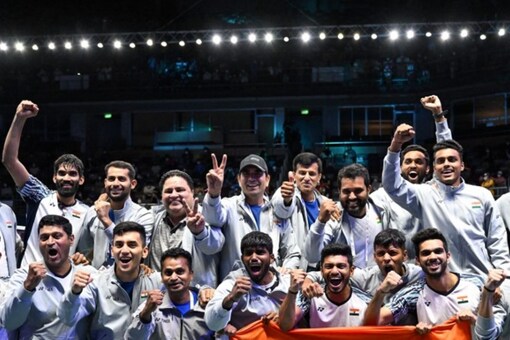 Members of the Indian men's badminton team celebrate after defeating Indonesia in the men's finals of the Thomas and Uber Cup badminton tournament in Bangkok on May 15, 2022.
Manan VATSYAYANA / AFP
