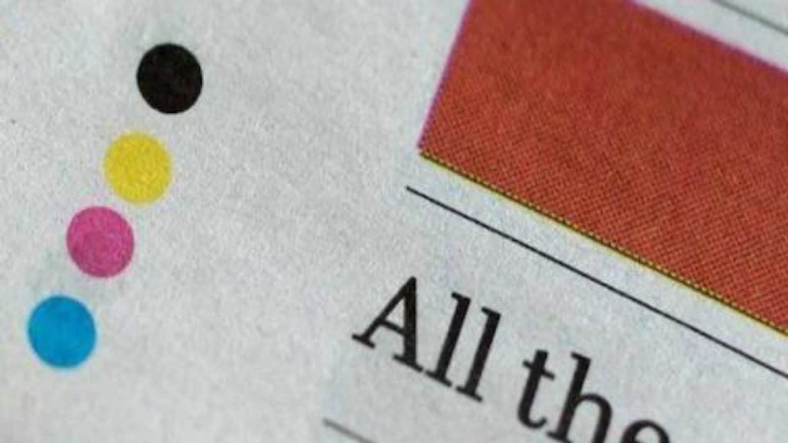 Spotted 4 Dots at The Backside of Each and every  page in Newspaper