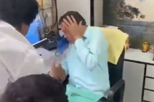 Maharashtra BJP spokesperson Vinayak Ambekar was assaulted by NCP workers on Sunday. (Image: @Chandrakant Patil/Twitter)