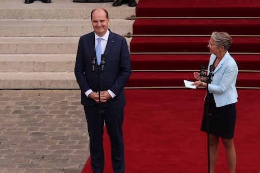 Newly appointed PM Elisabeth Borne (R) and her predecessor Jean Castex at a handover ceremony in Hotel Matignon, French PM's official residence, in Paris on Monday. (Image: Thomas Samson/ Pool via REUTERS)