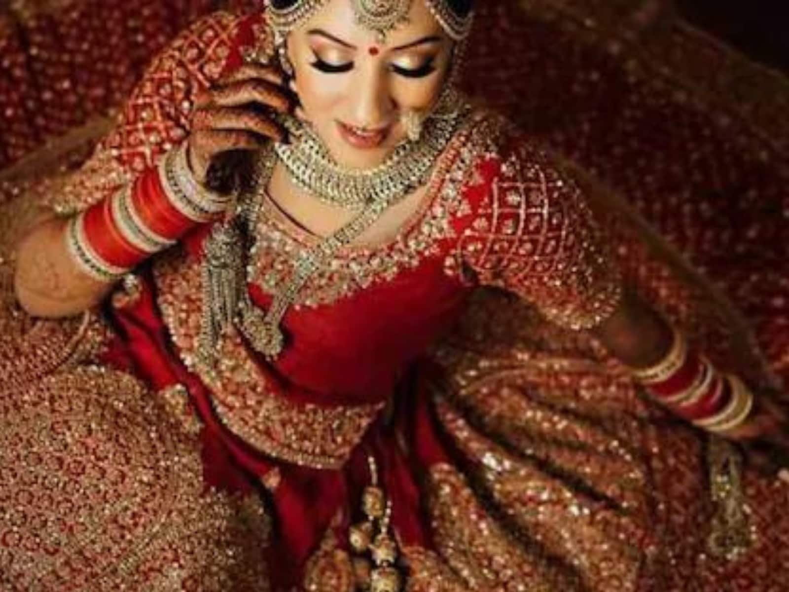 Make-up studio by Rohini Kakade - A bride in a red lehenga looks absolutely  stunning with an airbrushed makeup look created for the bride's wedding.  The bride is glowing with the highlighter