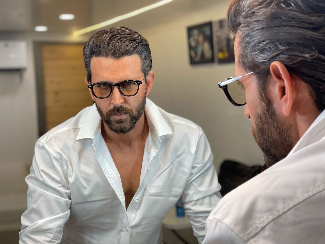 Keeping it classic and chic, Hrithik Roshan looks handsome in a white shirt.