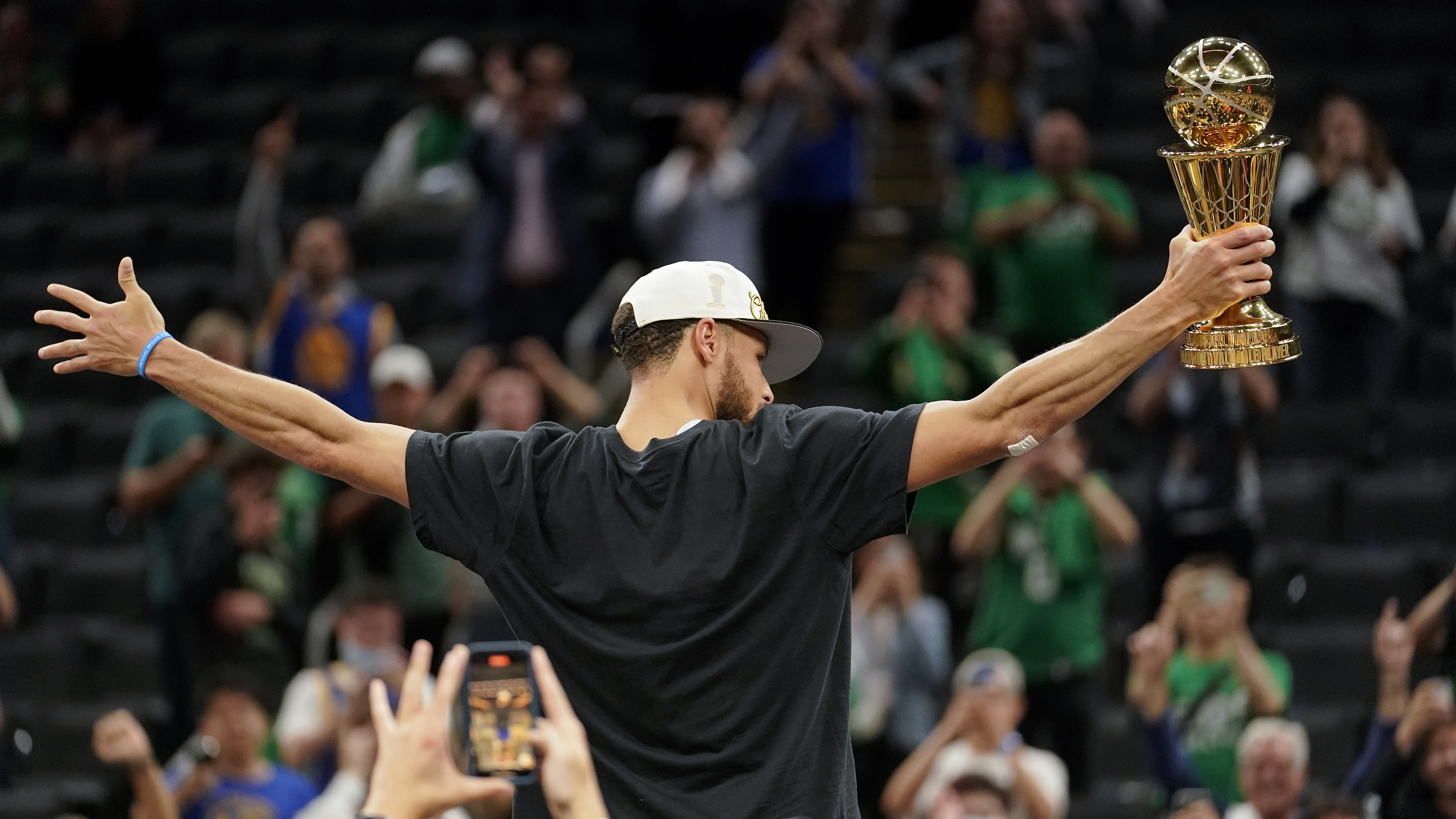 Stephen Curry Golden State Warriors Unsigned 2018 NBA Finals Trophy  Celebration Spotlight Photograph 