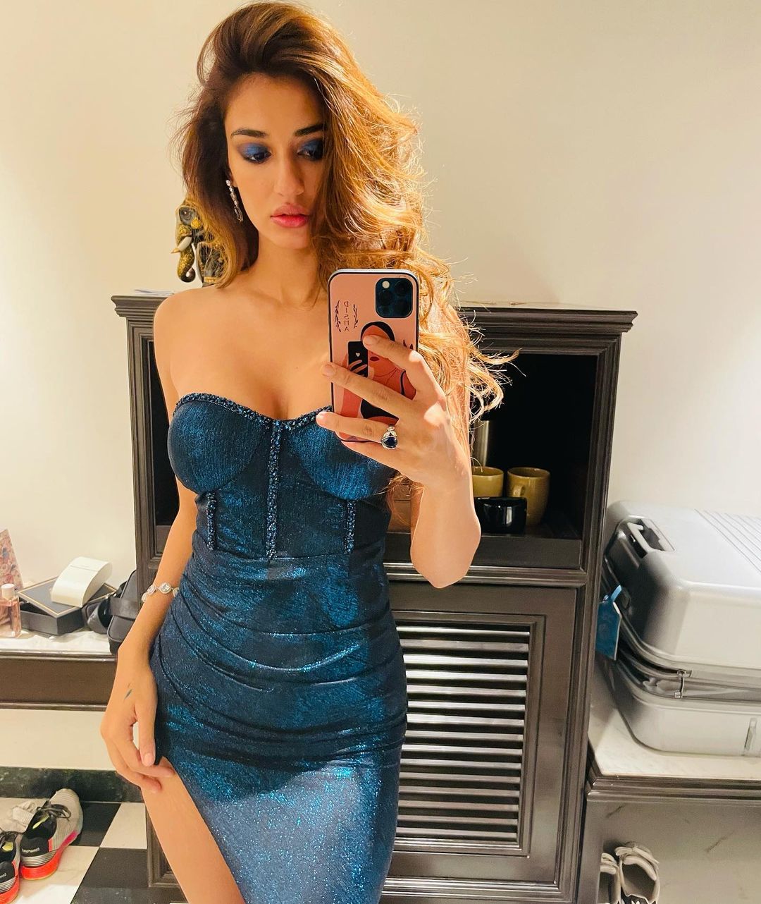 Disha Patani oozes sexiness in the off-shoulder blue metallic dress.