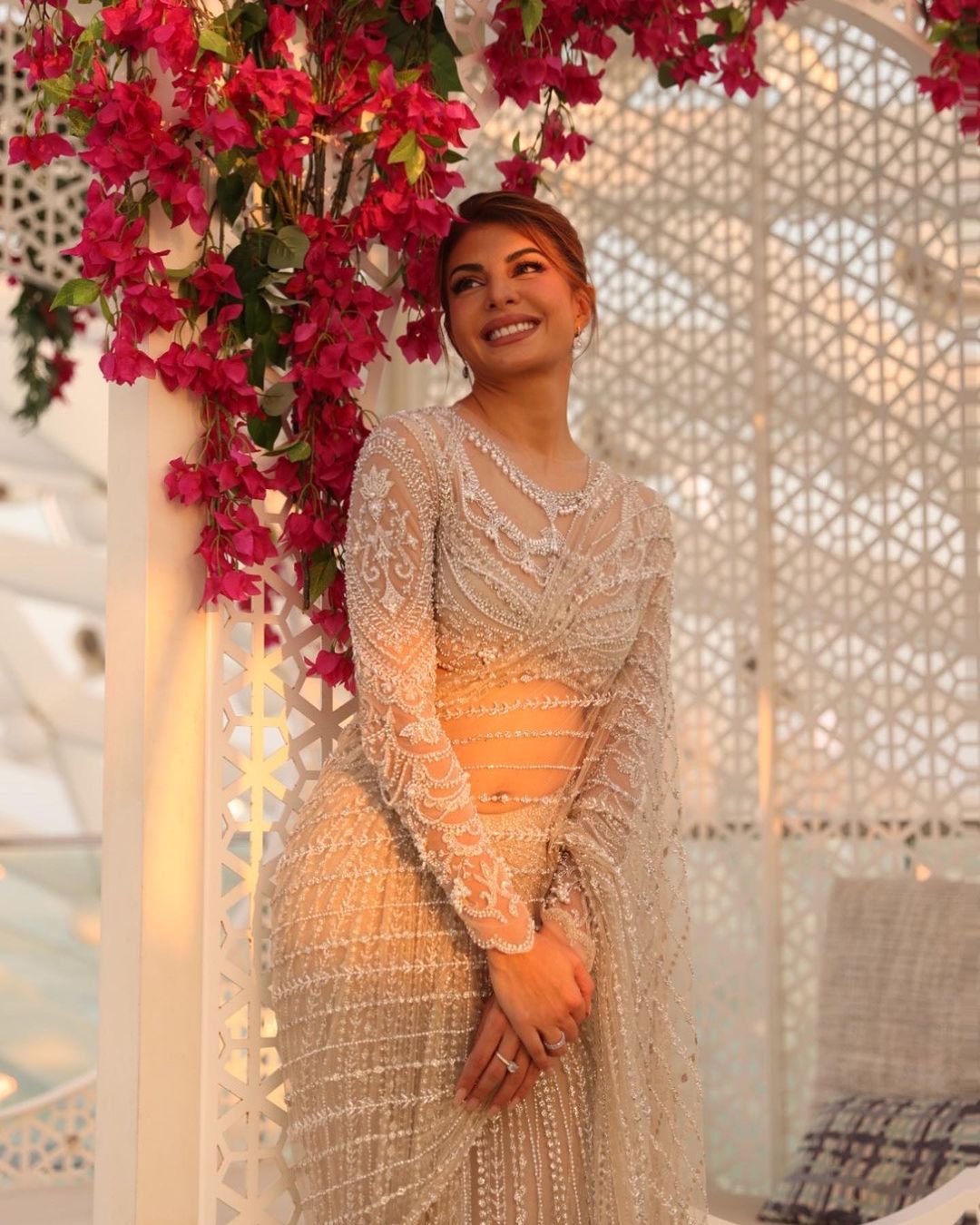 Jacqueline Fernandez looks chic in the embellished see-through saree. 