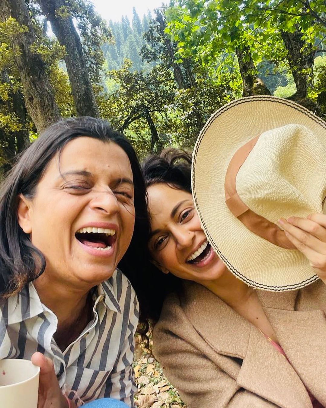 Kangana Ranaut and sister Rangoli Chandel share a laugh.
