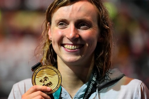 Katie Ledecky of the United States poses with her medal. (AP Photo)