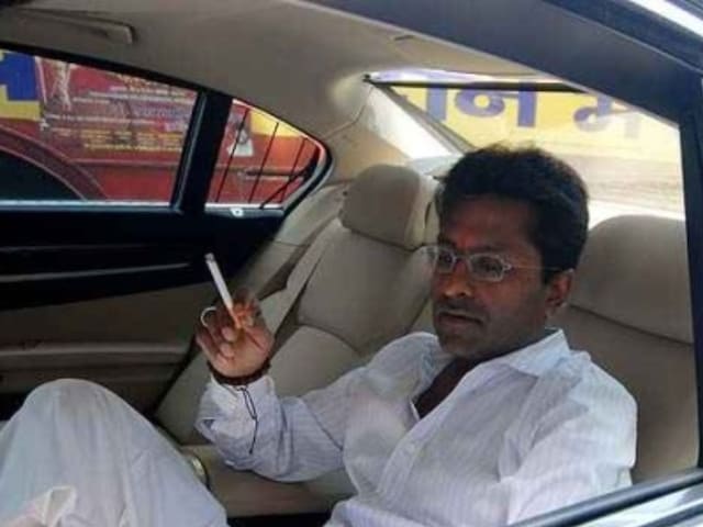 Lalit Modi rides his car back in 2010.