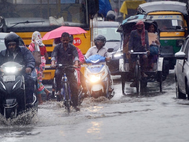 Vehicles wade through a waterlogged road after rainfall in Ranchi, on June 21, 2022. (PTI)