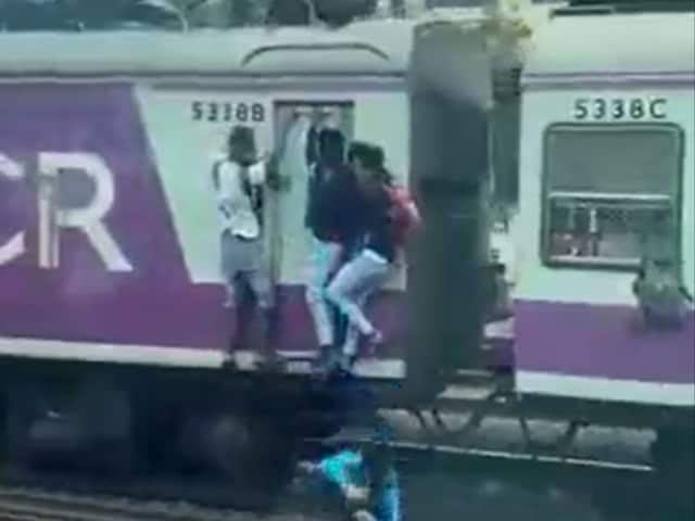 An 18-year-old falls off a Mumbai local. (Image: video grab)
