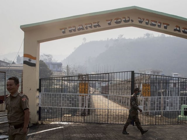 An Indian Army personnel and a Mizo policeman patrol at the India-Myanmar border gate , in Champhai village, in Mizoram. Many students from Myanmar enter through Champhai to attend schools in Mizoram (Image: AP Photo)