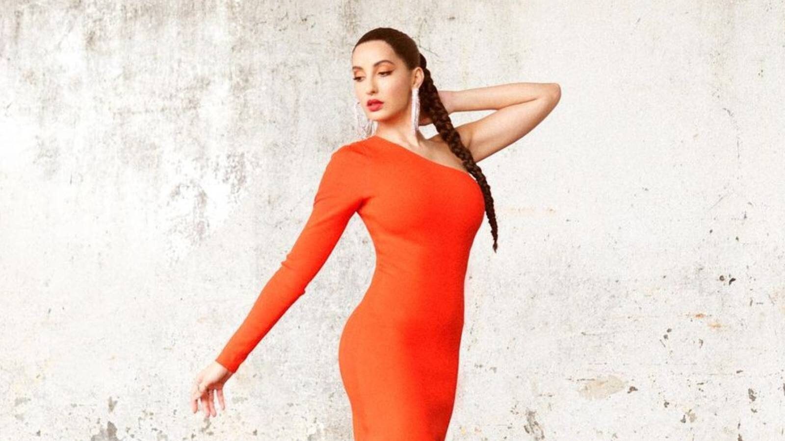 Nora Fatehi oozes glamour in a sultry bodycon dress with plunging neckline