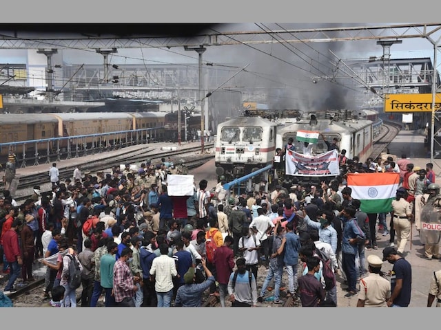 A mob vandalises trains and railway properties at the Secunderabad Railway Station. (Image: PTI)