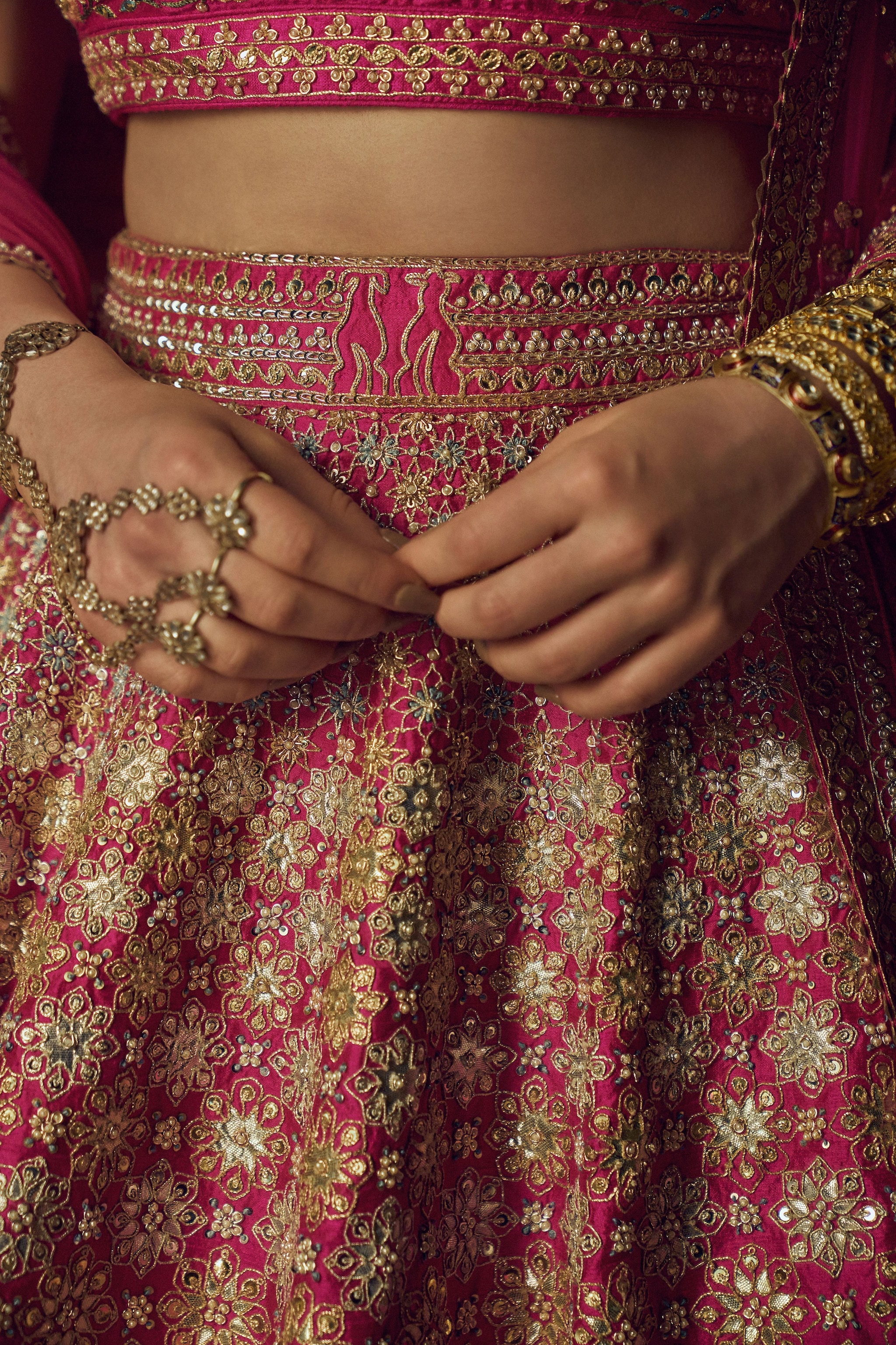 The lehenga was hand embroidered on raw silk and was adorned with gotta patti and sequins