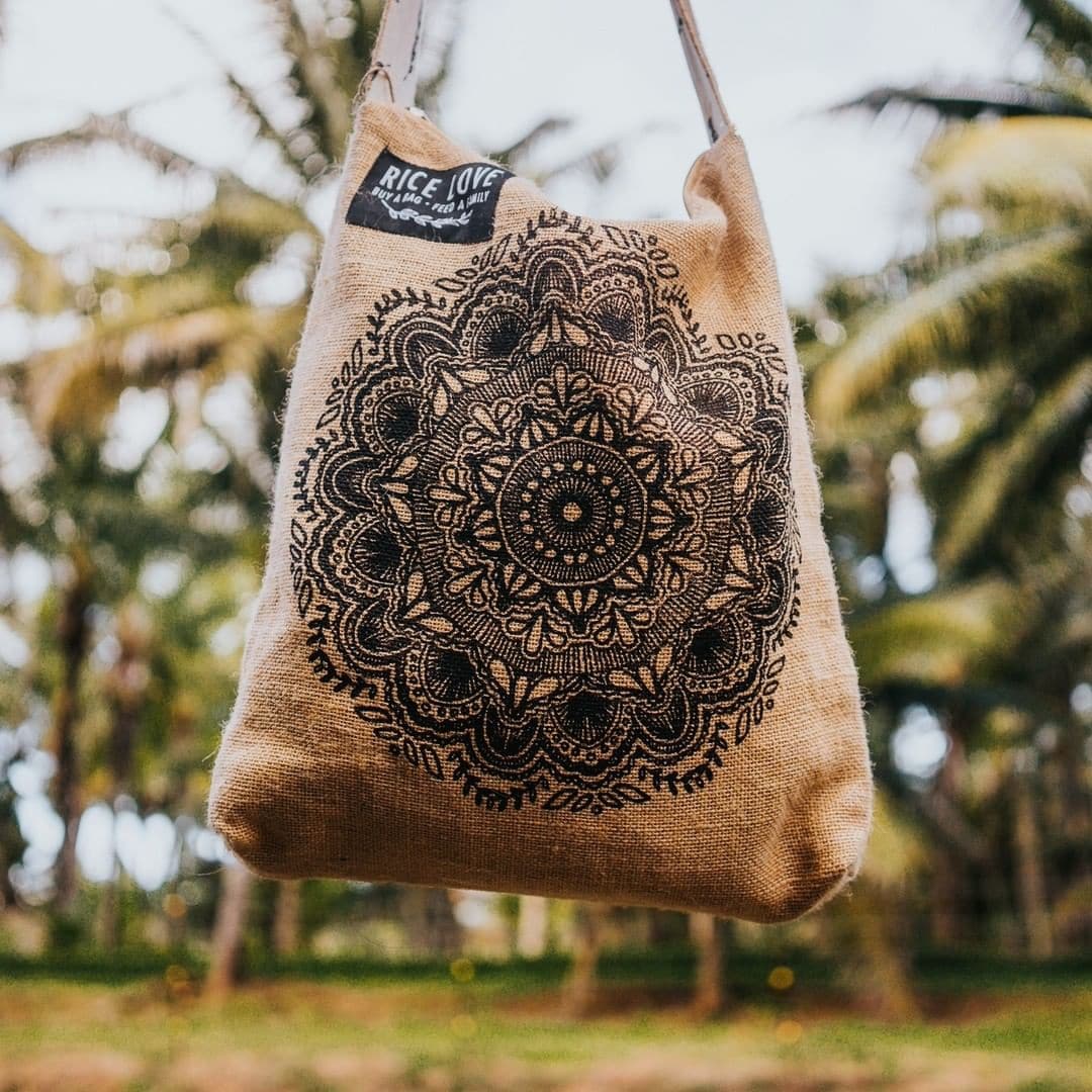 The bag is handmade from recycled jute/burlap rice bags.