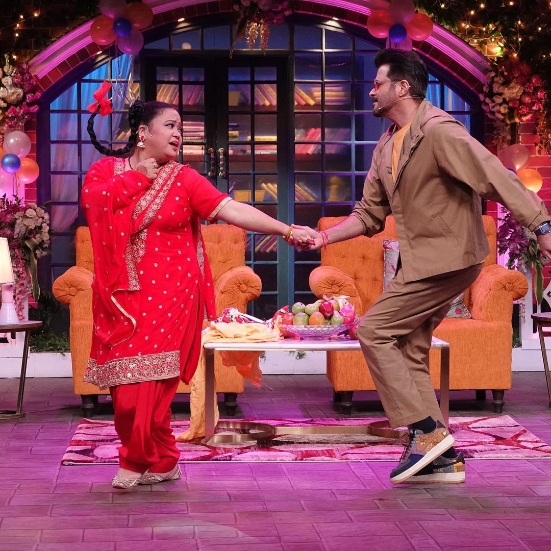 Bharti never fails to leave us all in splits. This picture from The Kapil Sharma Show shows her entertaining Anil Kapoor with her comic abilities. (Image: Instagram)