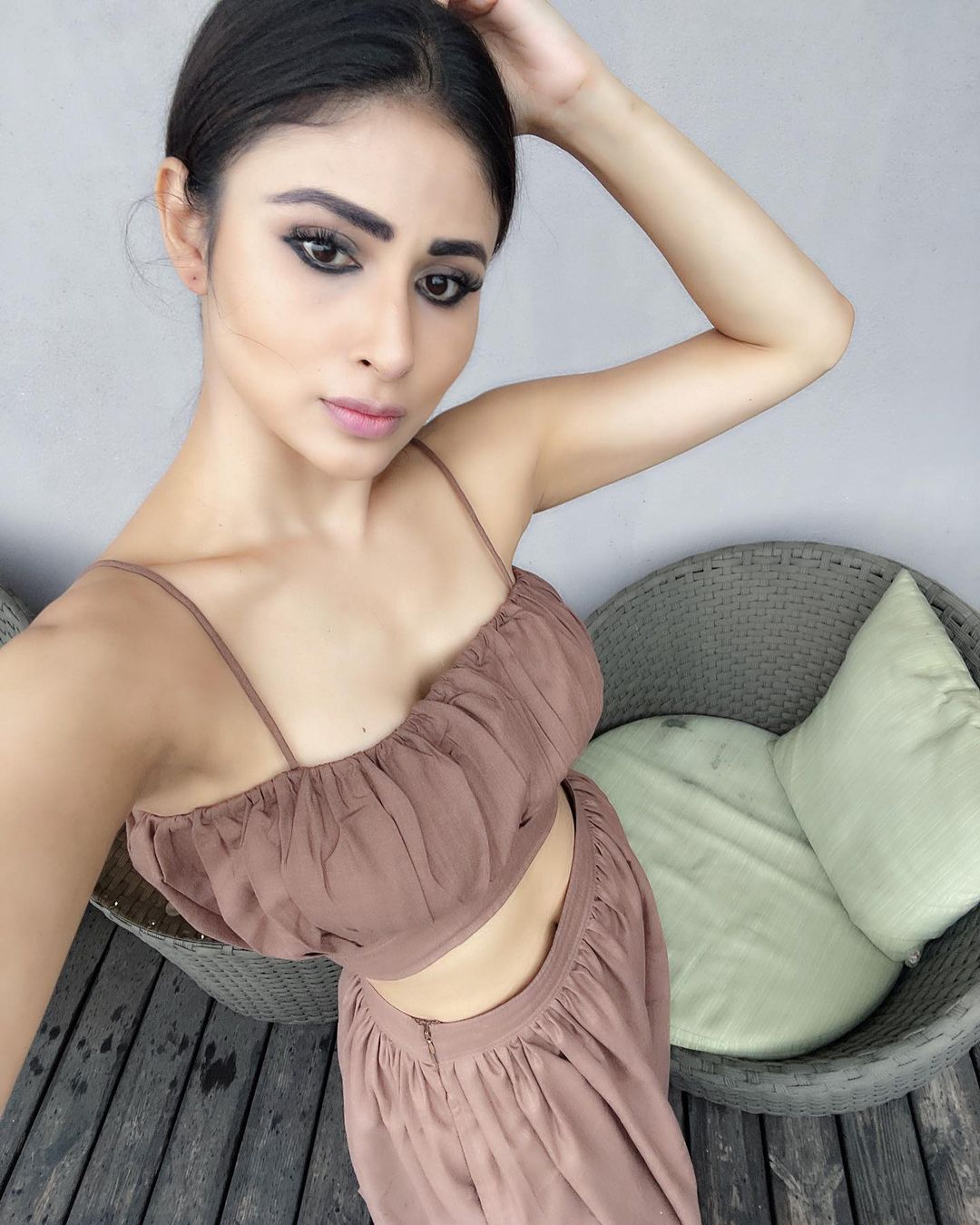 Mouni Roy clicks a selfie before heading out.