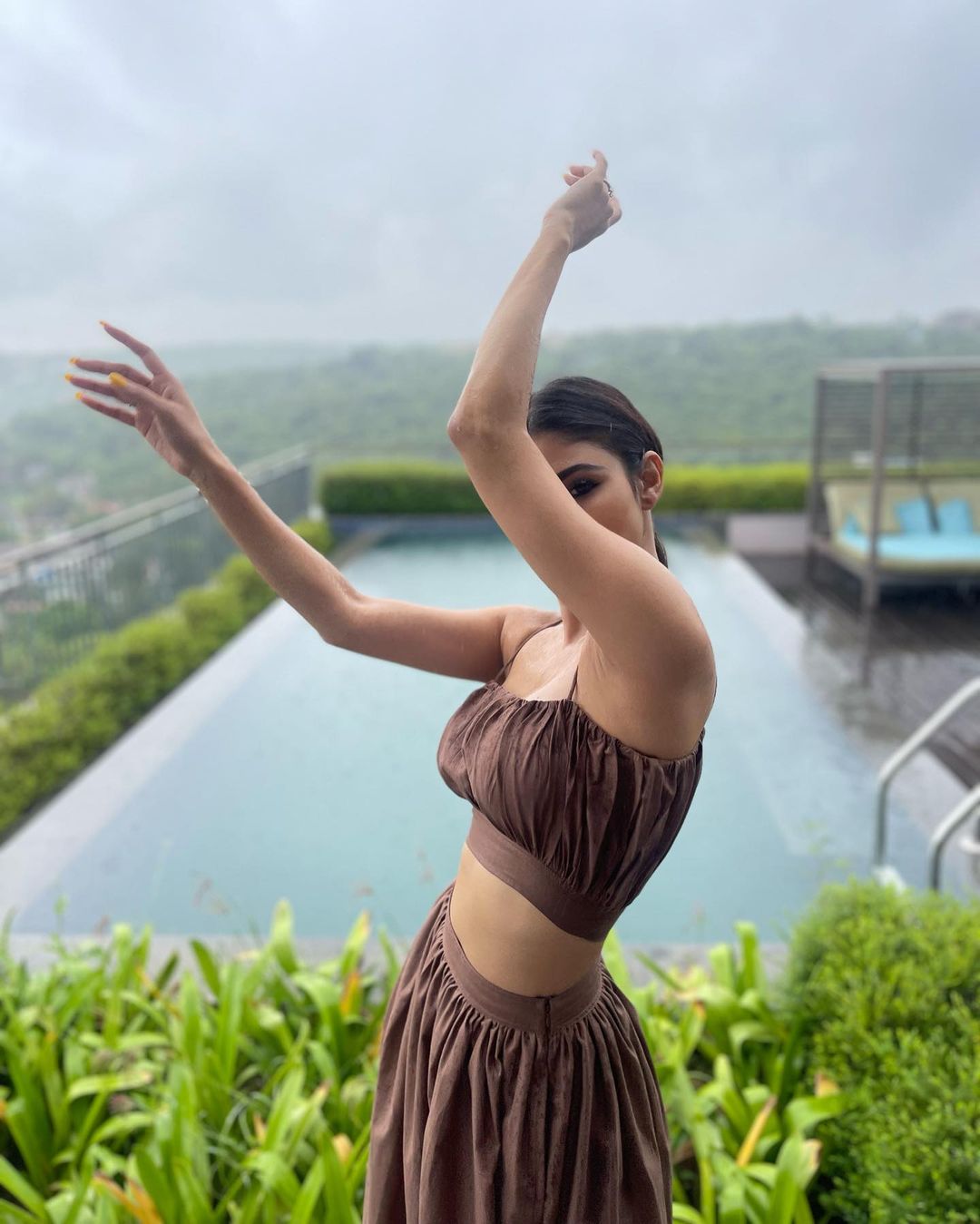 Mouni Roy looks pretty in the brown bralette and matching skirt. 