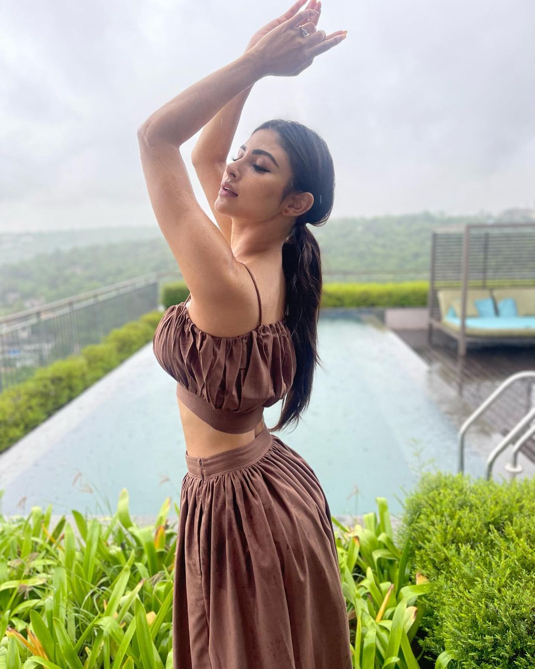 Mouni Roy makes the most of the season by posing in the rains. 