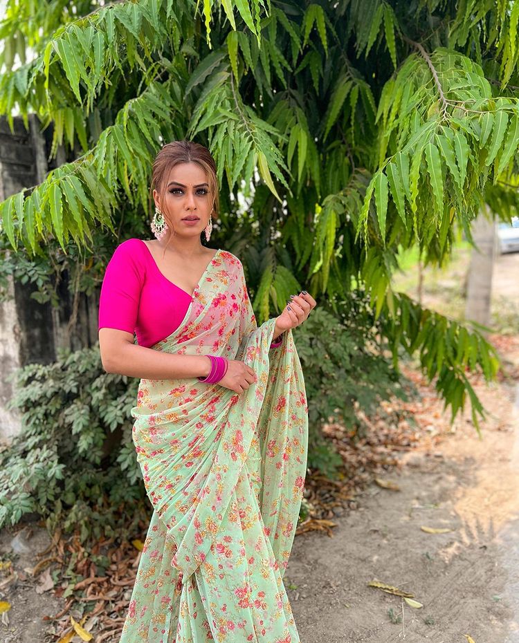 Nia Sharma looks graceful in the floral chiffon saree.