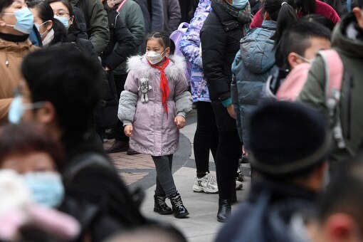 Residents line up for nucleic acid testing at a residential compound in Wuhan, Hubei province, China (Image: Reuters File)