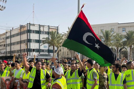 People protest against a power outage inside Martyrs' Square, in Tripoli, Libya. Protests caused damage to the parliament building in the eastern city of Tobruk on Friday as well (Image: Reuters)
