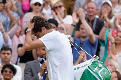 Taylor Fritz of the US reacts as he leaves the court after losing to Spain's Rafael Nadal in a men's singles quarterfinal match on day ten of the Wimbledon tennis championships in London, Wednesday, July 6, 2022. (Photo: AP)