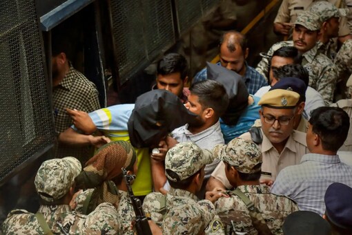 Riaz Akhtari and Ghouse Mohammad, accused in the murder of tailor Kanhaiya Lal, being produced at district court, in Udaipur, on June 30, 2022. (PTI)