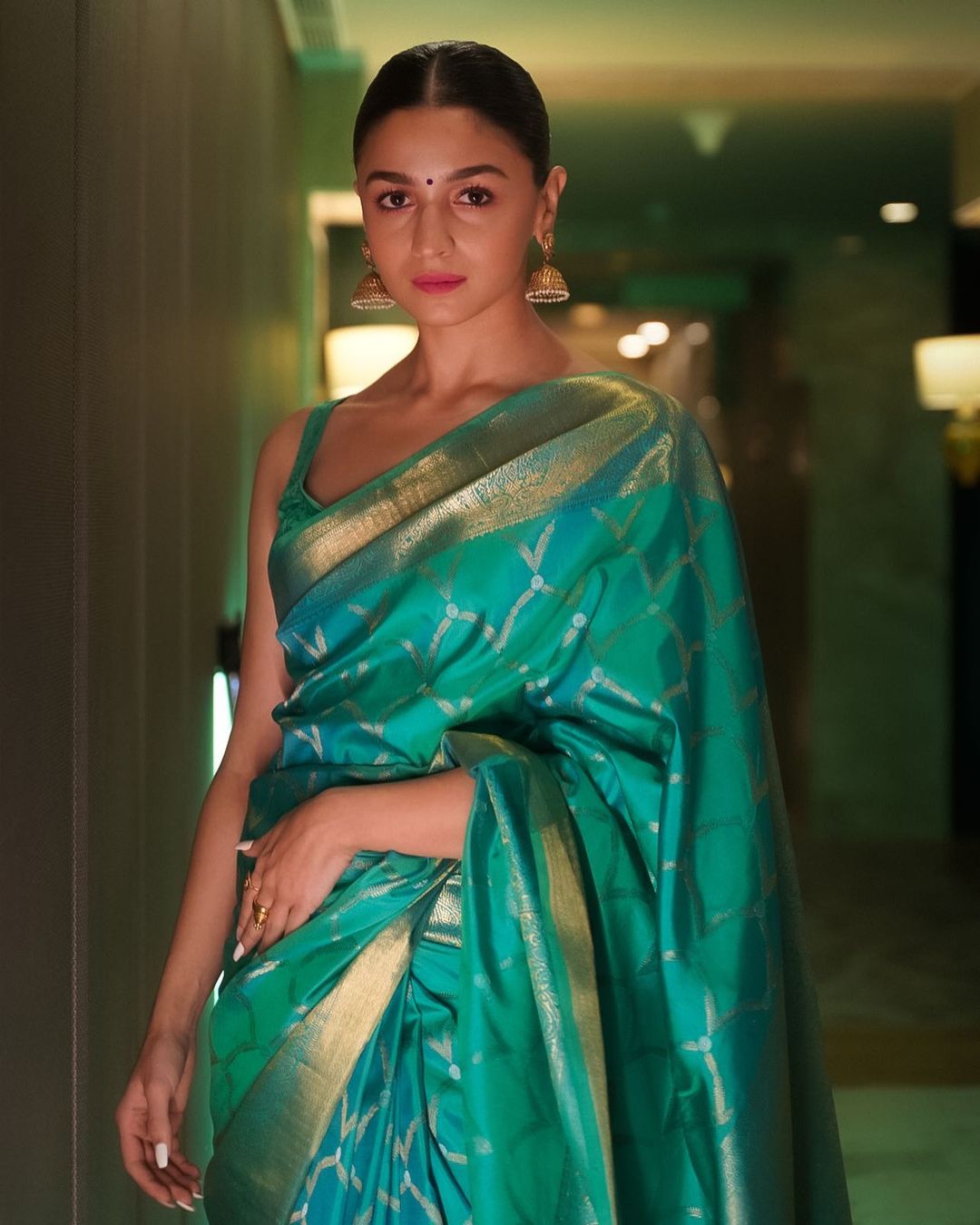 Alia Bhatt looks elegant in a traditional Kanchivaram two tone saree by Madhurya.