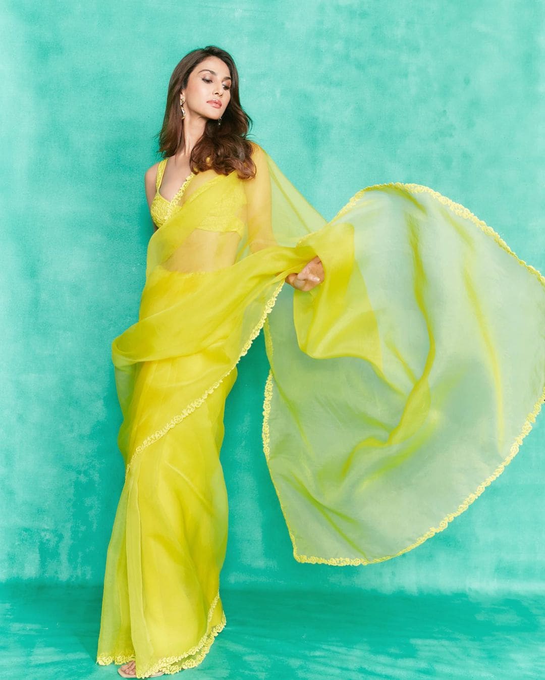 Vaani Kapoor looks like sunshine in Manish Malhotra’s canary yellow organza saree.