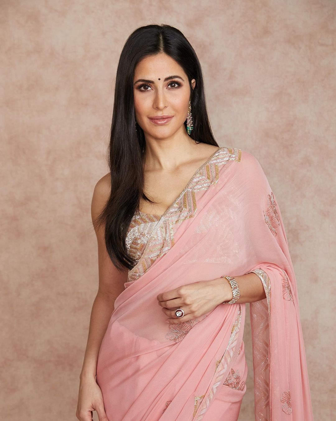 This plain blush pink saree with a heavy blouse is a perfect way to get the minimalist yet stylish festive look. (Image: Instagram/katrinakaif)