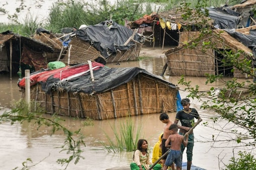 Houses belonging to slum-dwellers partially submerged in the floodplains of the swollen Yamuna river, during the  monsoon season in New Delhi, Saturday, Aug. 13, 2022. (PTI Photo)