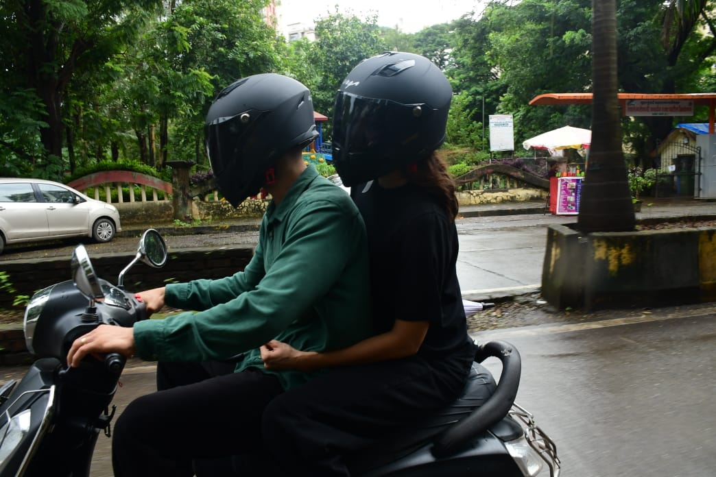 Anushka Sharma and Virat Kohli go on a scooter ride in Mumbai on Saturday. (Photo: Viral Bhayani) 
