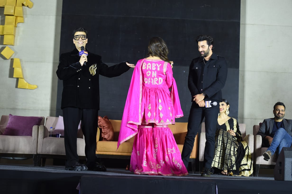 Alia Bhatt is seen flanked by Karan Johar and Ranbir Kapoor. 