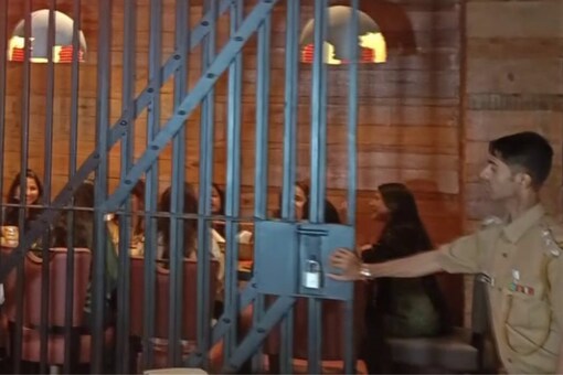 A person donning a constable's uniform stands guard at the bars. (Credits: ANI)