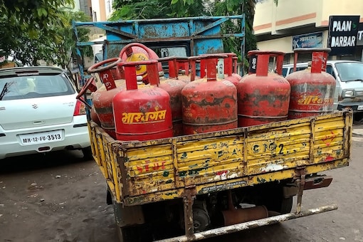 Surar resident Jasmin Merchant reached a polling station in Varachha Road constituency with a gas cylinder on his shoulder. (Image: Shutterstock)