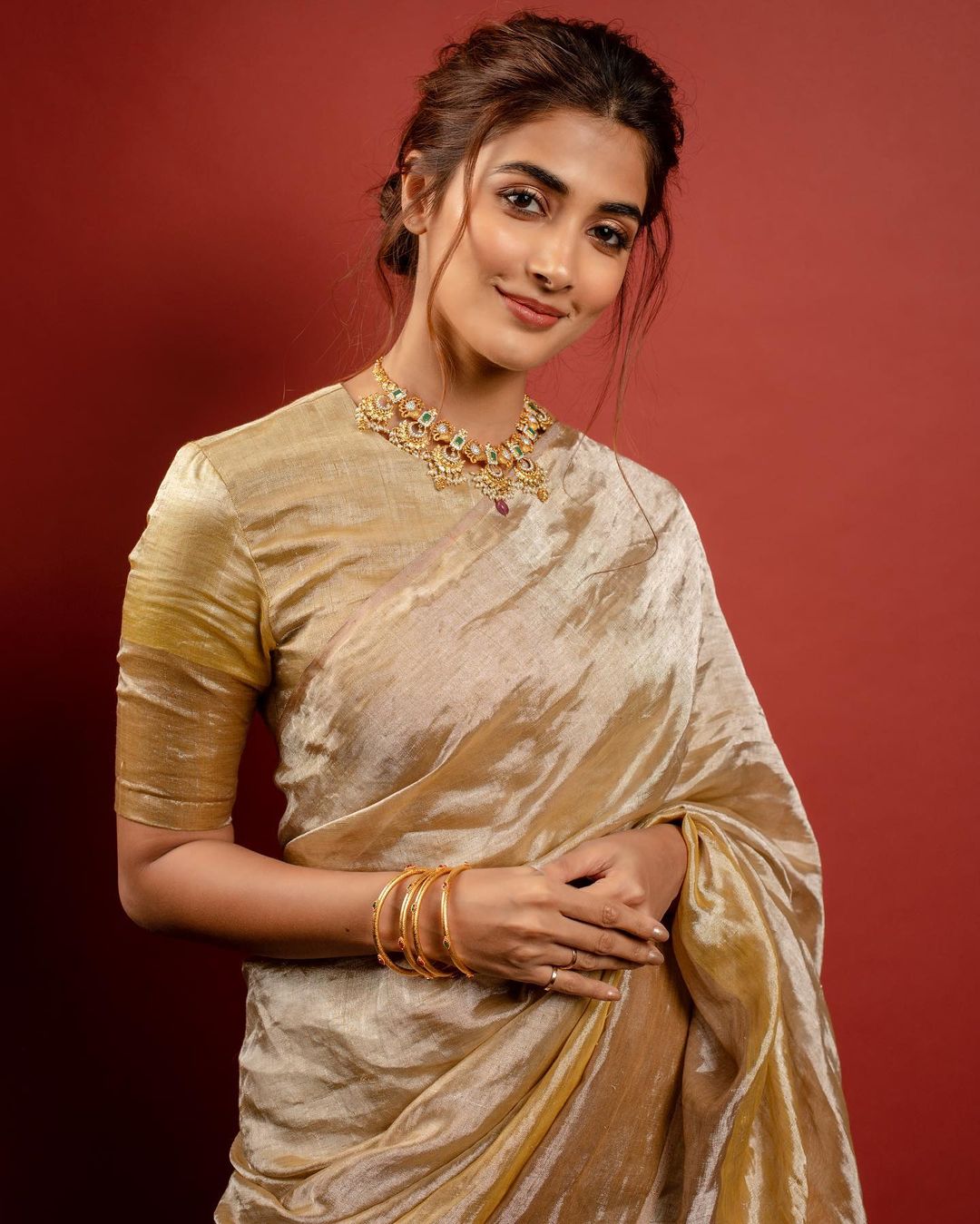 Pooja Hegde accessorises the look with an ornate neckpiece.