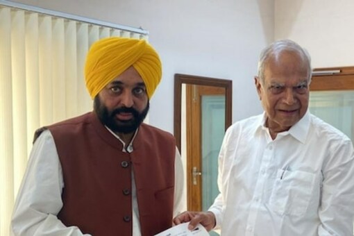 Punjab governor Banwarilal Purohit (R) and chief minister Bhagwant Mann. File pic/ANI