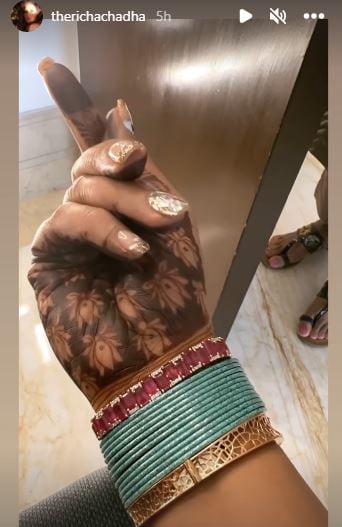 Richa Chadha flaunts her heena, bangles and nail art. 