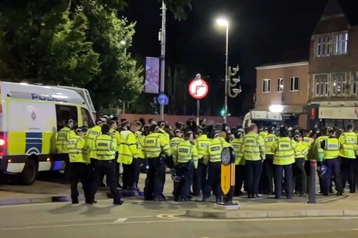 Police patrol the Belgrave Road. (Twitter/Video Grab/Leicestershire Police)
