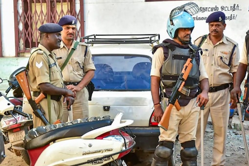Police personnel during a raid of NIA at the residence of a functionary of PFI in Madurai on Sept 22.(Image: PTI)