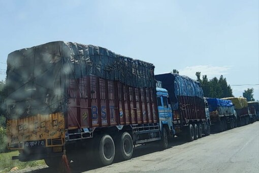 Kashmir-bound trucks laden with essential supplies and other vehicles pass through the highway. (Image: News18)