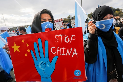 Ethnic Uighur demonstrators take part in a protest against China, in Istanbul, Turkey on October 1, 2021. (REUTERS/Dilara Senkaya)