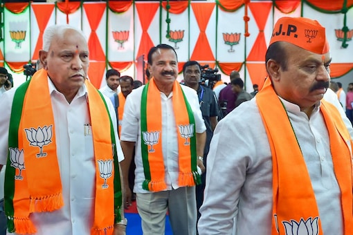 Karnataka chief minister Basavaraj Bommai, with BJP parliamentary board member BS Yediyurappa and senior party leader Sadananda Gowda, arrives to take part in the party's state executive committee meeting, in Bengaluru, Friday, October 7, 2022. (PTI Photo)