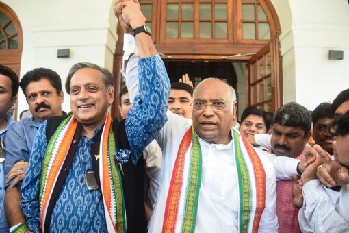 Shashi Tharoor greets newly elected Congress President Mallikarjun Kharge at the latter's residence, in New Delhi, Wednesday. (PTI Photo) 